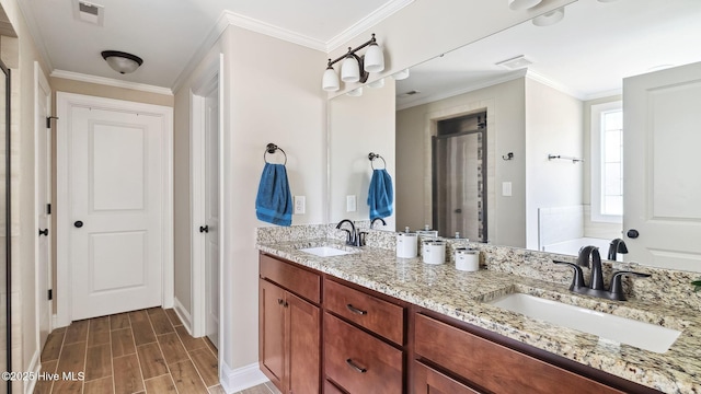 bathroom with wood finish floors, a sink, visible vents, and crown molding