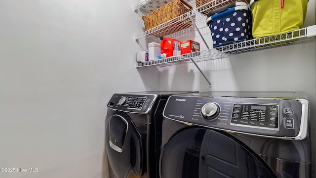 laundry area with laundry area and washer and clothes dryer