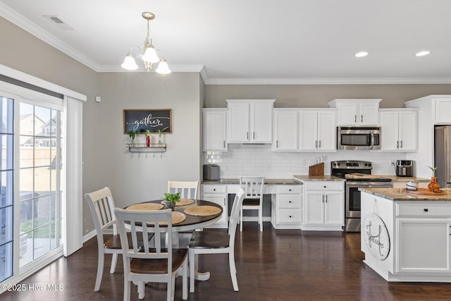 kitchen with dark wood-type flooring, light stone counters, decorative backsplash, white cabinets, and stainless steel appliances