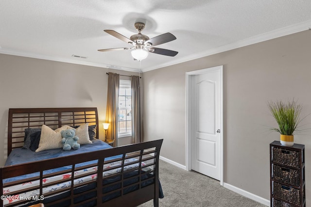 bedroom featuring visible vents, carpet flooring, and crown molding