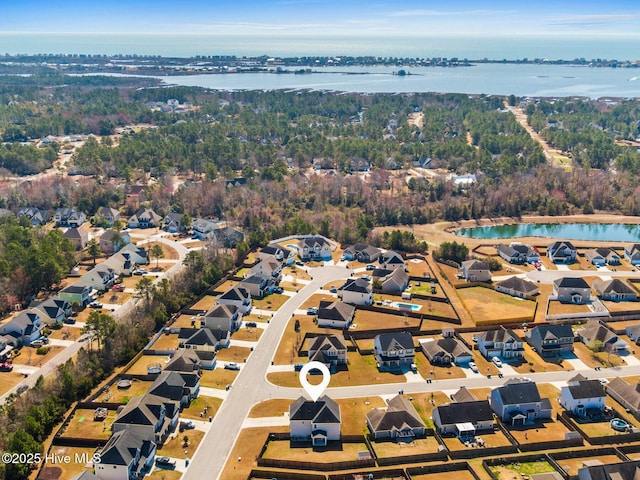 birds eye view of property with a residential view and a water view