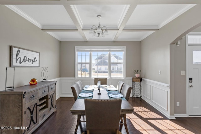 dining room featuring an inviting chandelier, dark wood-style floors, arched walkways, and coffered ceiling