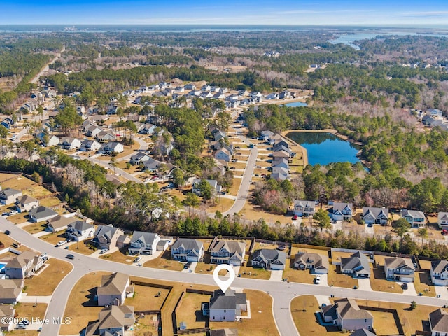 birds eye view of property featuring a residential view and a water view