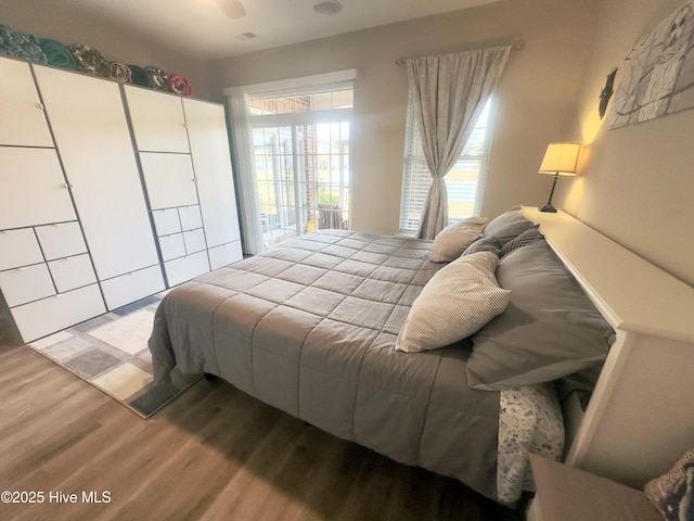 bedroom featuring wood finished floors