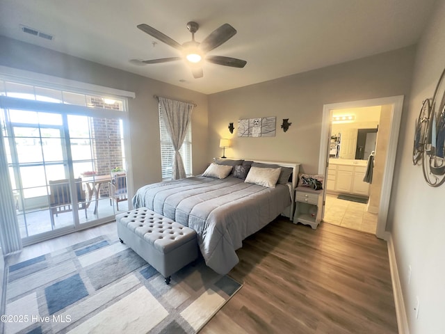 bedroom featuring baseboards, visible vents, ceiling fan, wood finished floors, and access to exterior