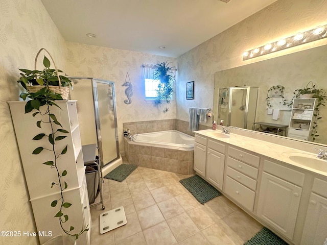 full bathroom featuring tile patterned floors, a sink, a bath, and a shower stall