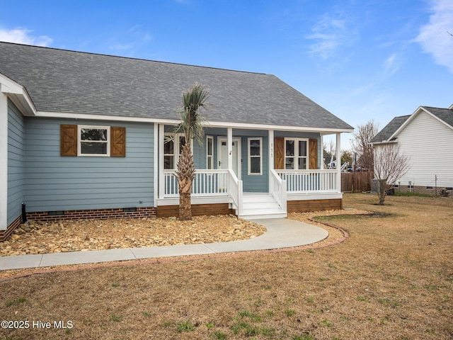 ranch-style home featuring a shingled roof, a front yard, crawl space, and covered porch