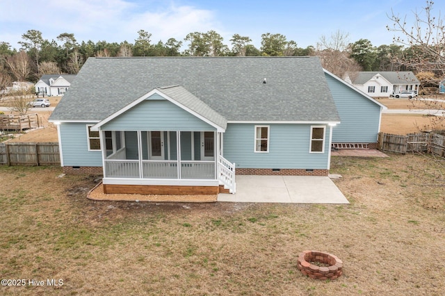 back of property featuring crawl space, a patio area, a sunroom, and roof with shingles