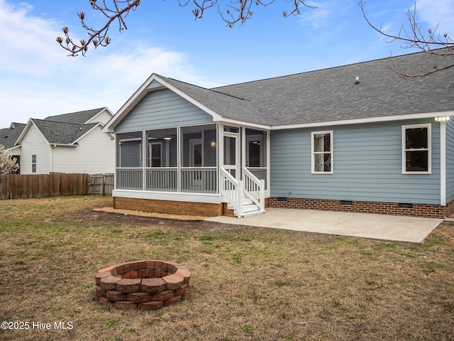 back of property featuring a shingled roof, crawl space, fence, a yard, and a patio area