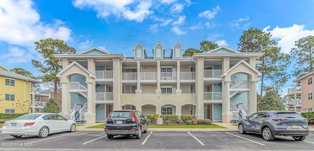 view of building exterior with uncovered parking