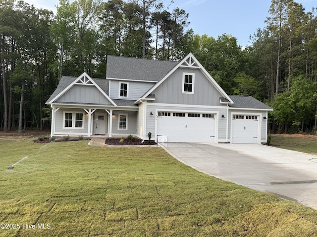 516 Belcroft Dr, Carthage, NC 28327 - view of front of home featuring board and batten siding, a shingled roof, driveway, a front lawn, and a porch