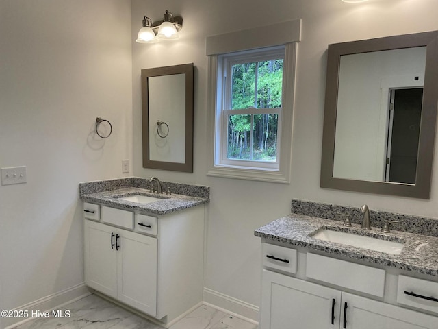 516 Belcroft Dr, Carthage, NC 28327 - bathroom with baseboards, marble finish floors, and two vanities