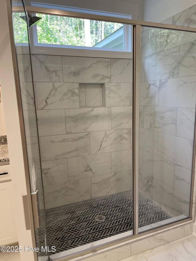 516 Belcroft Dr, Carthage, NC 28327 - bathroom featuring a stall shower and marble look tiles