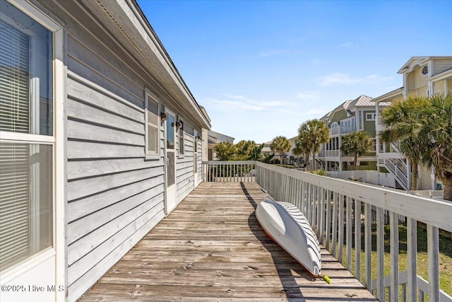 wooden terrace with a residential view