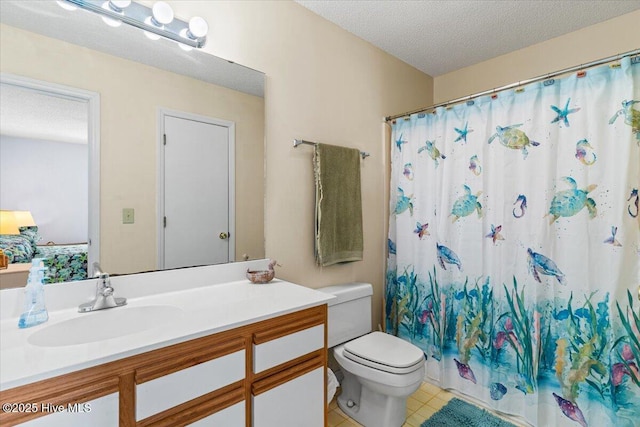 full bathroom with tile patterned floors, toilet, curtained shower, a textured ceiling, and vanity