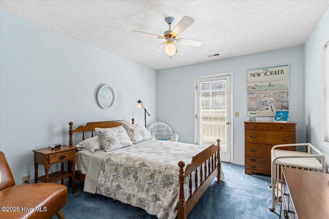 carpeted bedroom featuring a ceiling fan, a textured ceiling, visible vents, and access to exterior