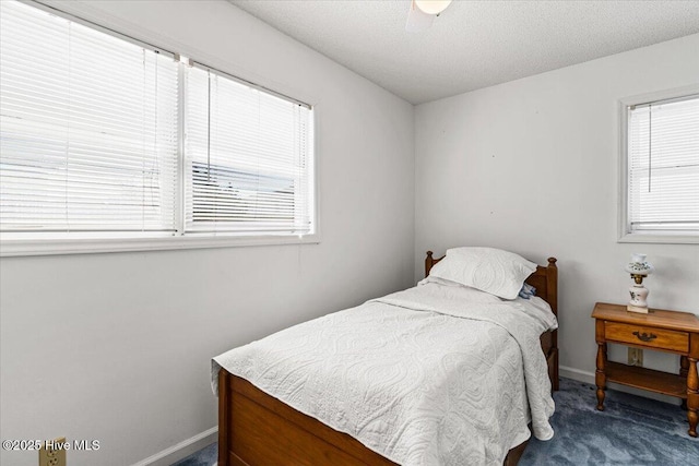 bedroom with multiple windows, baseboards, and carpet floors