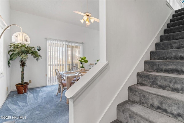 stairway with baseboards and carpet