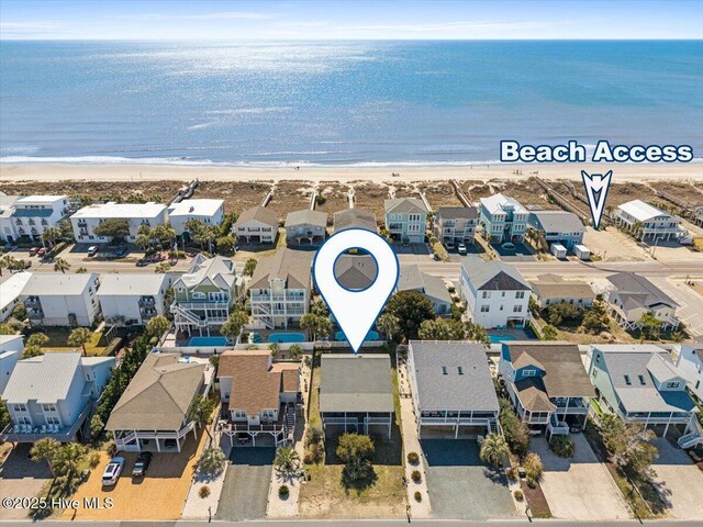 birds eye view of property with a water view, a residential view, and a view of the beach