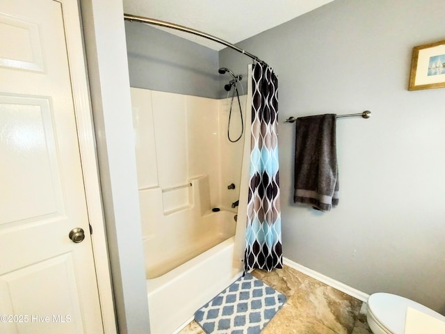 full bath with shower / tub combo, baseboards, and toilet