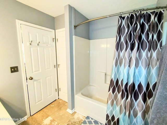 bathroom with shower / tub combo with curtain