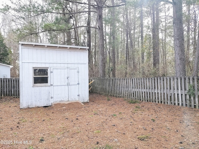 view of shed with a fenced backyard