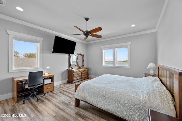 bedroom featuring baseboards, recessed lighting, light wood-style floors, and crown molding