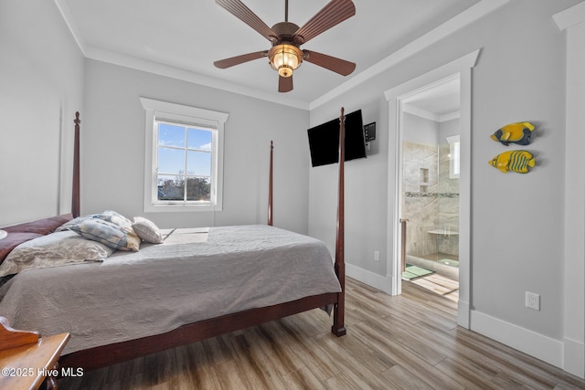 bedroom with light wood-style flooring, ensuite bath, crown molding, and baseboards