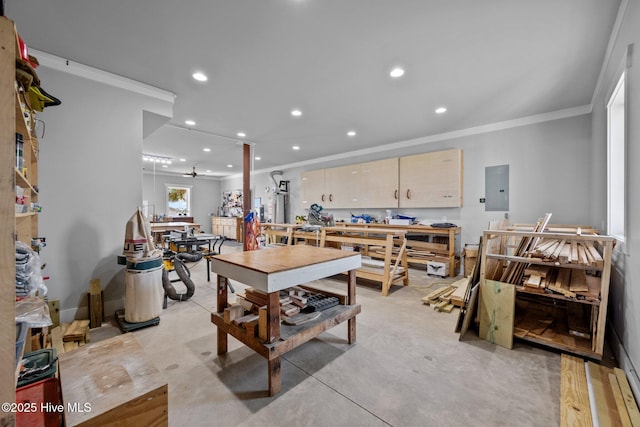 interior space featuring recessed lighting, electric panel, crown molding, and a workshop area