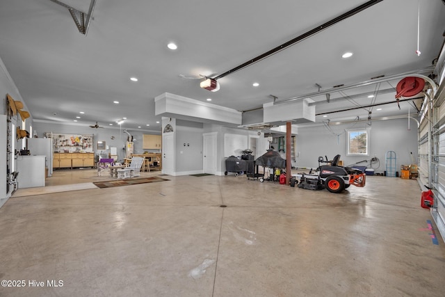 garage featuring recessed lighting and a garage door opener