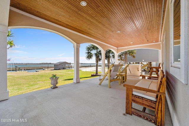 view of patio / terrace with a water view