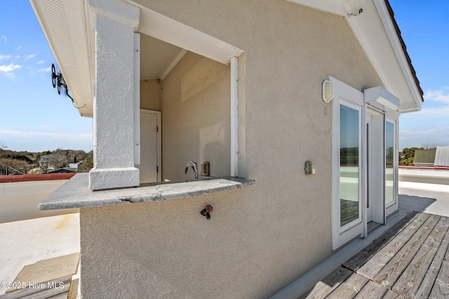 view of side of home featuring stucco siding