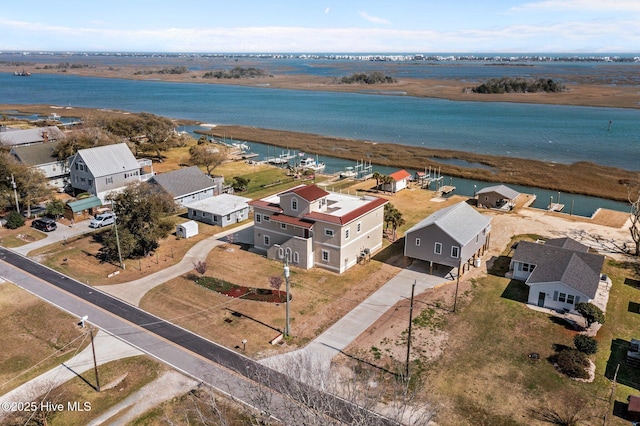 bird's eye view with a residential view and a water view