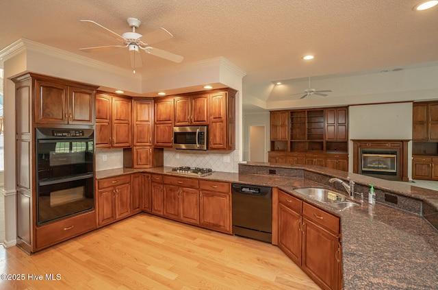 234 Crooked Gulley Cir, Sunset Beach, NC 28468 - kitchen with stainless steel appliances, a sink, ceiling fan, light wood-style flooring, and ornamental molding