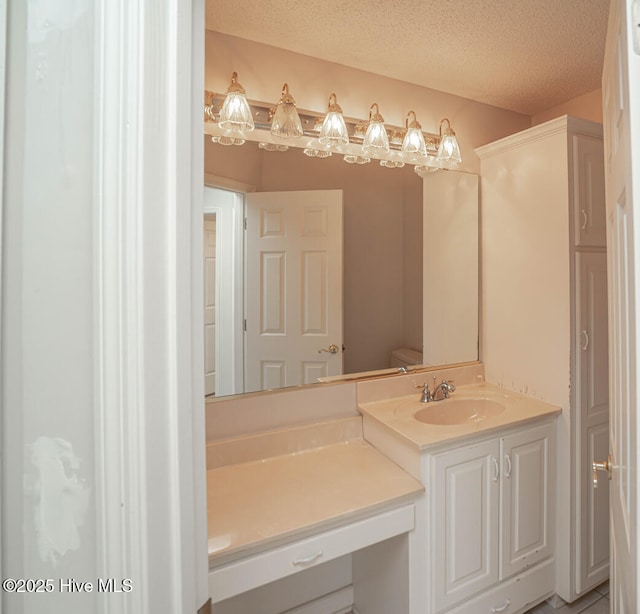 234 Crooked Gulley Cir, Sunset Beach, NC 28468 - bathroom with vanity and a textured ceiling