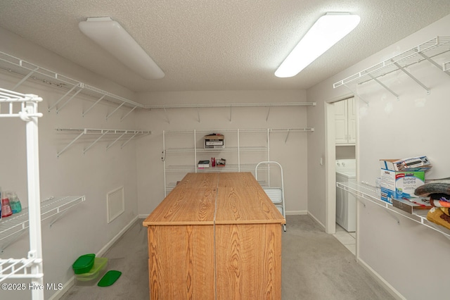 234 Crooked Gulley Cir, Sunset Beach, NC 28468 - walk in closet featuring light colored carpet and washer / dryer