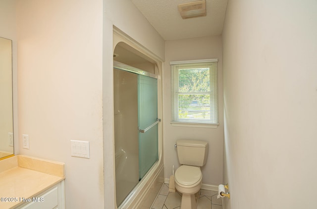 234 Crooked Gulley Cir, Sunset Beach, NC 28468 - bathroom featuring vanity, toilet, tile patterned floors, bath / shower combo with glass door, and baseboards