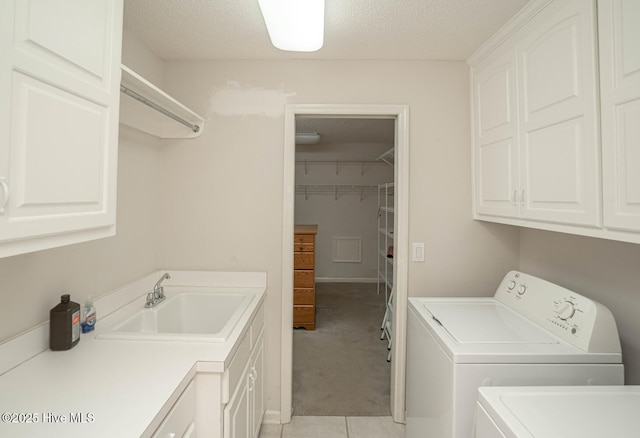 234 Crooked Gulley Cir, Sunset Beach, NC 28468 - washroom featuring cabinet space, washing machine and dryer, a textured ceiling, light colored carpet, and light tile patterned floors