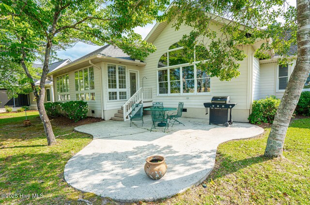 234 Crooked Gulley Cir, Sunset Beach, NC 28468 - rear view of property with a patio, crawl space, and a lawn