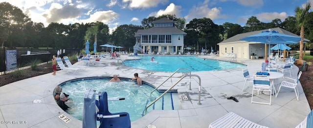 234 Crooked Gulley Cir, Sunset Beach, NC 28468 - community pool featuring a patio and view of scattered trees