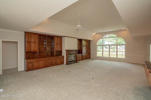 234 Crooked Gulley Cir, Sunset Beach, NC 28468 - unfurnished living room featuring a ceiling fan, a fireplace with flush hearth, baseboards, light carpet, and lofted ceiling