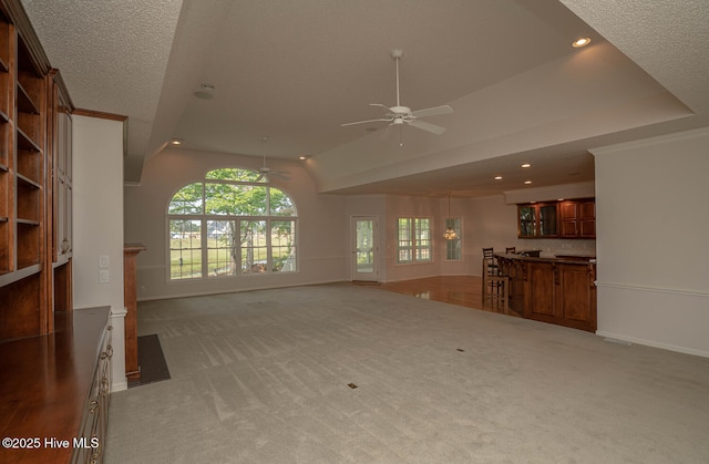 234 Crooked Gulley Cir, Sunset Beach, NC 28468 - unfurnished living room with ceiling fan, light colored carpet, baseboards, lofted ceiling, and recessed lighting