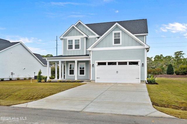 view of front of home with board and batten siding, a front yard, and concrete driveway