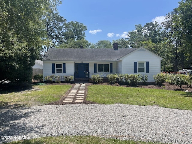 single story home with roof with shingles, a chimney, fence, and a front yard