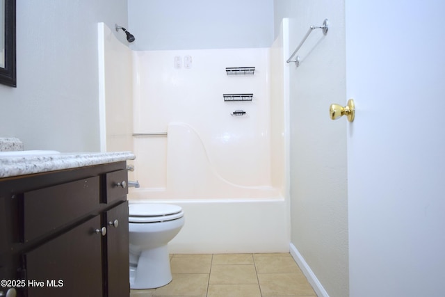 bathroom featuring toilet, tile patterned flooring, washtub / shower combination, and vanity