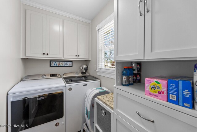 laundry area with washer and dryer and cabinet space