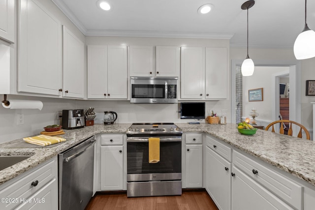 kitchen featuring appliances with stainless steel finishes, dark wood-type flooring, white cabinetry, and crown molding