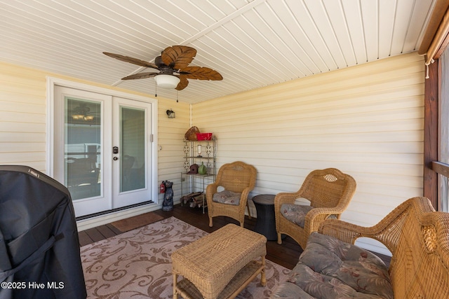 exterior space with a ceiling fan and wood ceiling