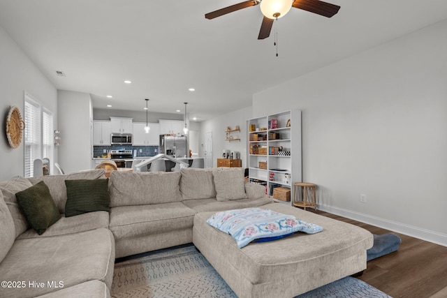 living area featuring recessed lighting, wood finished floors, a ceiling fan, visible vents, and baseboards