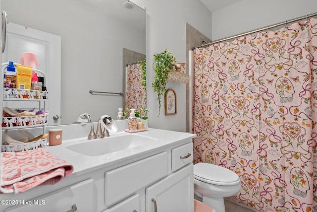 bathroom with toilet, curtained shower, and vanity